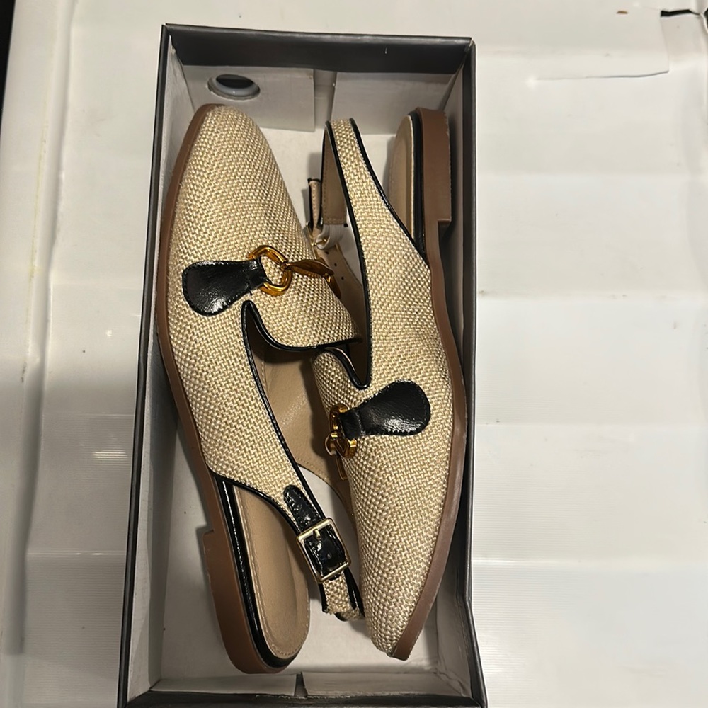 Beige and black work shoes